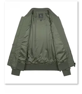 Detailed interior of olive green flight jacket showing satin lining and knit collar