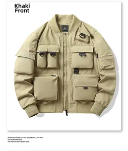 Detail of khaki tactical flight jacket showing multiple 3D pockets and D-ring loops