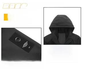 Detail of black hooded jacket with handmade label and metal eyelet in techwear style