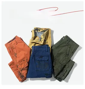 Detailed flat lay of men's cargo shorts showing orange, camo and navy cotton fabric