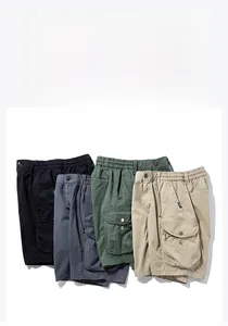 Flat lay of cargo shorts showing tactical pockets, drawstring waist, and four classic colors