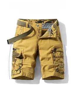 Detail view of khaki cargo shorts with camouflage accents and olive green canvas belt