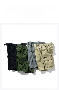 Flat lay of multi-pocket cargo shorts in black, army green, dark grey, and khaki colors