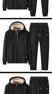 Close-up of black winter tracksuit with thick white faux shearling lining and classic woven labels