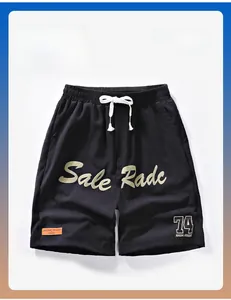 Detail of black ice silk quick-dry shorts with NASA branding and drawstring waist