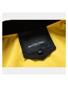 Detail of jacket inner neckline with yellow mesh lining and brand label stitching