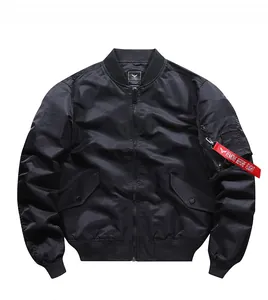 Detail of MA-1 flight jacket showing the utility sleeve pocket and red flight ribbon