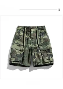 Detail view of army green camo cargo shorts with elastic drawstring waist and large pockets
