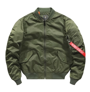 Detail view of MA-1 flight jacket showing arm pocket with iconic red utility ribbon tag