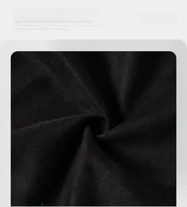 Macro detail showing the high-quality black faux suede fabric texture and soft fiber weave