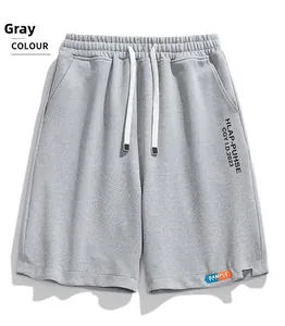 Detail of grey casual shorts featuring textured fabric and adjustable white drawstring