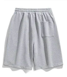 Close-up of grey casual shorts featuring twill texture, elastic waistband and back pocket