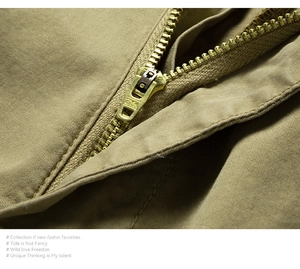 Close-up of golden ZYK metal zipper and premium stitching on men's cargo shorts