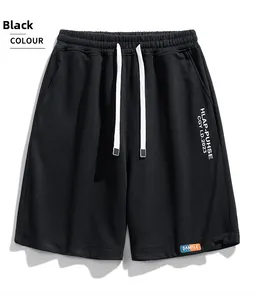 Detail of black sports shorts featuring waffle knit texture and contrast white drawstrings