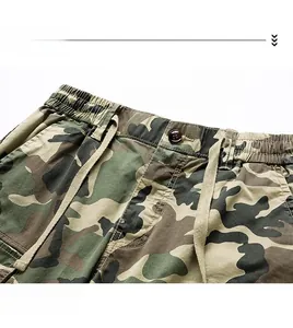 Detail view of camouflage cargo shorts showing elastic waistband and drawstring texture