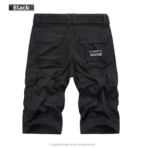 Detail view of men's black cotton cargo shorts with rear flap pockets and printed text