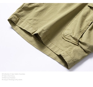 Close-up of olive green cargo shorts featuring double-stitched seams and side utility pockets