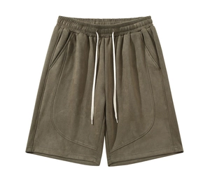 Detail of army green men's shorts featuring elastic waistband and white drawstring
