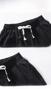 Detail of men's quick-dry shorts featuring an elastic waistband and metal tip drawstrings
