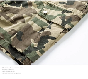 Detailed macro view of jungle camo cargo shorts with metal button flap pocket and stitching