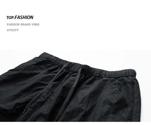 Detail of elastic waistband and black drawstrings on quick-dry cargo shorts