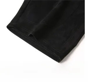Macro shot of precise stitching and premium faux suede texture on straight leg hem