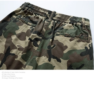 Detail of camouflage cargo shorts showing elastic waist and durable rear pocket craftsmanship