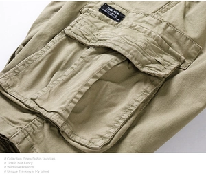 Close-up of khaki cargo shorts showing heavy-duty side flap pocket and woven label
