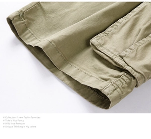Detail of military green cargo shorts featuring double-stitched seams and cuffed hem