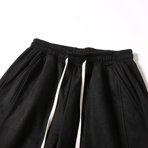 Men's casual black suede shorts featuring an elastic waistband and white drawstring