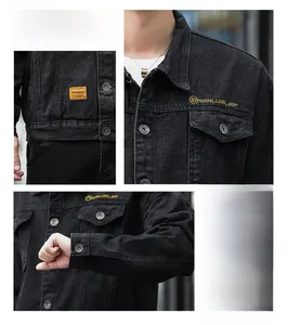 Detail of black denim jacket featuring yellow fashion label and chest embroidery