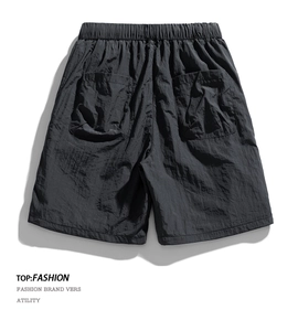 Detail showing elastic waistband and large back pockets on quick-dry cargo shorts