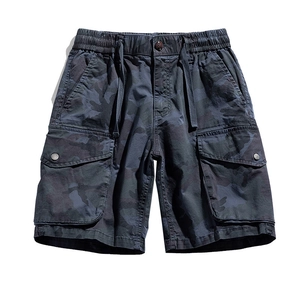 Men's loose techwear cargo shorts with dark camouflage pattern and elastic drawstring waist