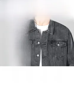 Detail of grey washed denim jacket featuring lapel collar and chest embroidery logo