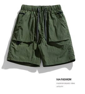 Detail of army green cargo shorts with drawstring waist and D-ring tactical pocket
