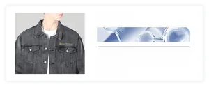 Detail view of charcoal denim jacket lapel and embroidered pocket logo design