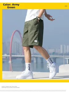 Detail of army green cargo shorts featuring drawstring waist and side pocket design