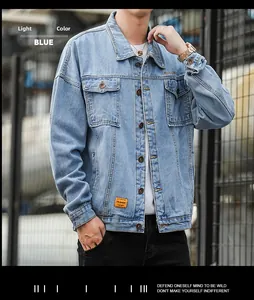 Detail of light blue denim jacket with classic lapels and orange decorative label tags