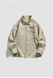 Detail of beige long-sleeve corduroy shirt featuring dark vertical stripes and chest pocket