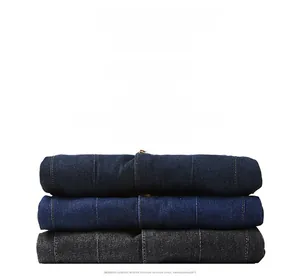 Detail of high-quality denim fabric stitching and texture in three colors for men's casual wear