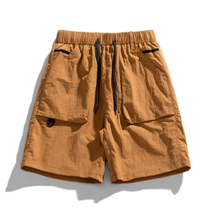 Outdoor cargo ice silk shorts for men in mustard yellow with utility pockets