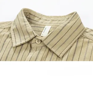 Close-up of khaki striped corduroy shirt collar with buttons and fine stitching