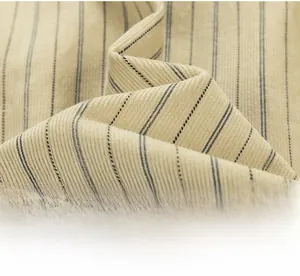 Close-up detail of beige striped shirt fabric showing fine texture and vertical ribbing