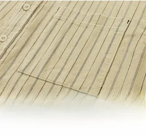 Detail of corduroy long-sleeve shirt showing chest pocket and navy striped texture