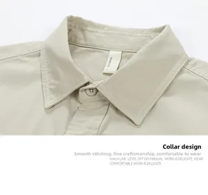 Close-up of the standard collar and stitching details on a khaki long-sleeve cotton shirt
