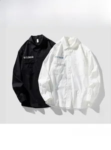 Men's long-sleeve utility shirts in black and white with dual chest flap pockets