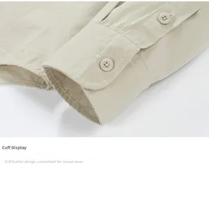 Detail view of khaki shirt cuffs featuring single-button closure and fine stitching