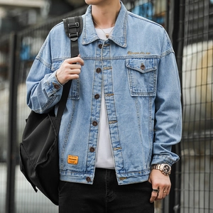 Men's light blue loose denim jacket with chest embroidery and stylish orange hem label