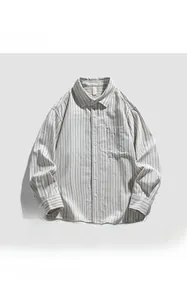 Close-up of casual cream-white long-sleeved shirt featuring fine vertical stripes and pocket