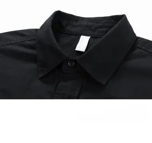 Detailed close-up of the black shirt collar featuring a classic pointed lapel and buttons